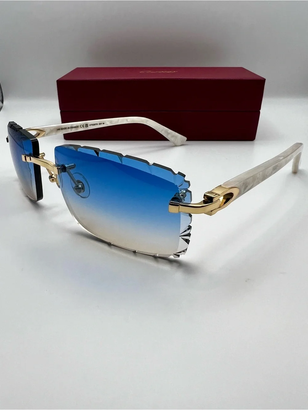 Cartier Blue Gradient Rimless Sunglasses with Gold and White Accents